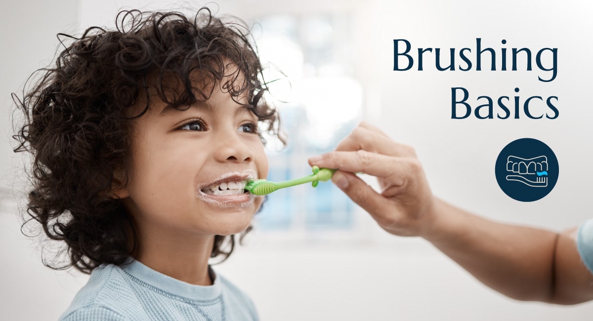 An adult brushing a child's teeth with the words brushing basics on the image.